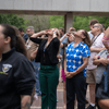 A crowd of people outside or in a lobby celebrating the 2024 eclipse in Texas. 