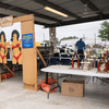 A group of people gather outside for a chili cook-off.