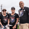 A group of people gather outside for a chili cook-off.