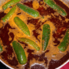 A group of people gather outside for a chili cook-off.