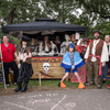 A group of people gather outside for a chili cook-off.