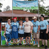 A group of people gather outside for a chili cook-off.