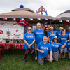 A group of people gather outside for a chili cook-off.