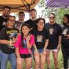 A group of people gather outside for a chili cook-off.