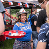 A group of people gather outside for a chili cook-off.