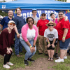 A group of people gather outside for a chili cook-off.