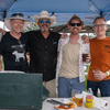 A group of people gather outside for a chili cook-off.