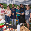 A group of people gather outside for a chili cook-off.