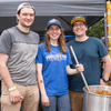 A group of people gather outside for a chili cook-off.