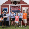 A group of people gather outside for a chili cook-off.