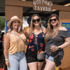 A group of people gather outside for a chili cook-off.