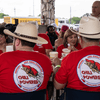 A group of people gather outside for a chili cook-off.