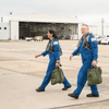 Two astronauts prepare to fly on T-38 jets.