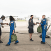 Two astronauts prepare to fly on T-38 jets.