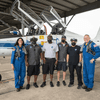 Two astronauts prepare to fly on T-38 jets.