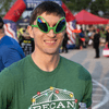 A group of people dressed in costumes outside during a race event.