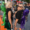 A group of people dressed in costumes outside during a race event.