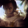 Color television view of Cernan during one of the broadcasts on the first mission day. Image Credit: NASA