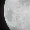 View of the receding Moon taken from Apollo 10 shortly after TEI. Mare Crisium is the large dark feature at left. Image Credit: NASA