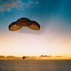 Apollo 10 floats beneath its three main parachutes just moments before splashdown in the Pacific Ocean east of American Samoa. Image Credit: NASA