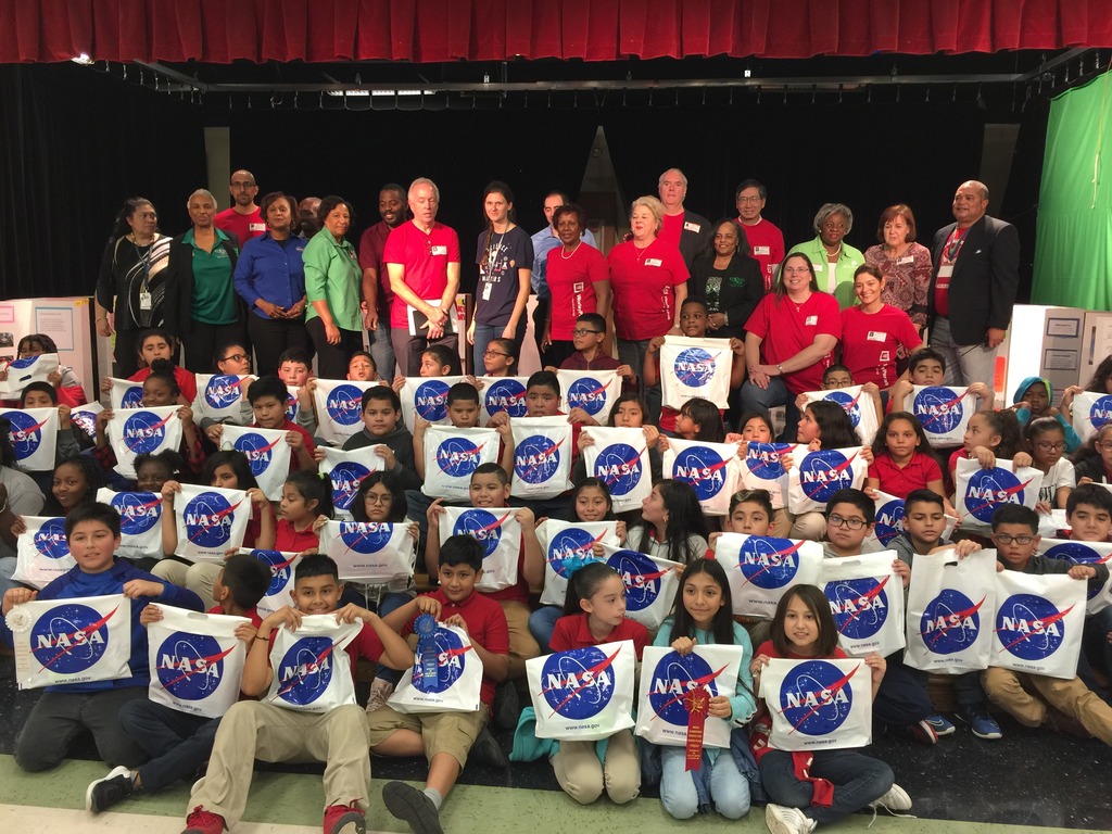 Johnson volunteers with other Johnson employees at a Houston elementary school.