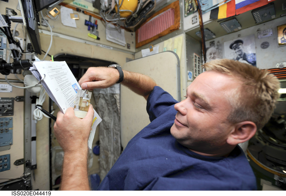 Cosmonaut Maxim Suraev, Expedition 21 and 22 flight engineer, prepares to work with BTKh-10/KONYUGATSIYA (Conjugation,building new recombinant producer strains of proteins using bacterial conjugation and plasmid mobilization technologies in space).  