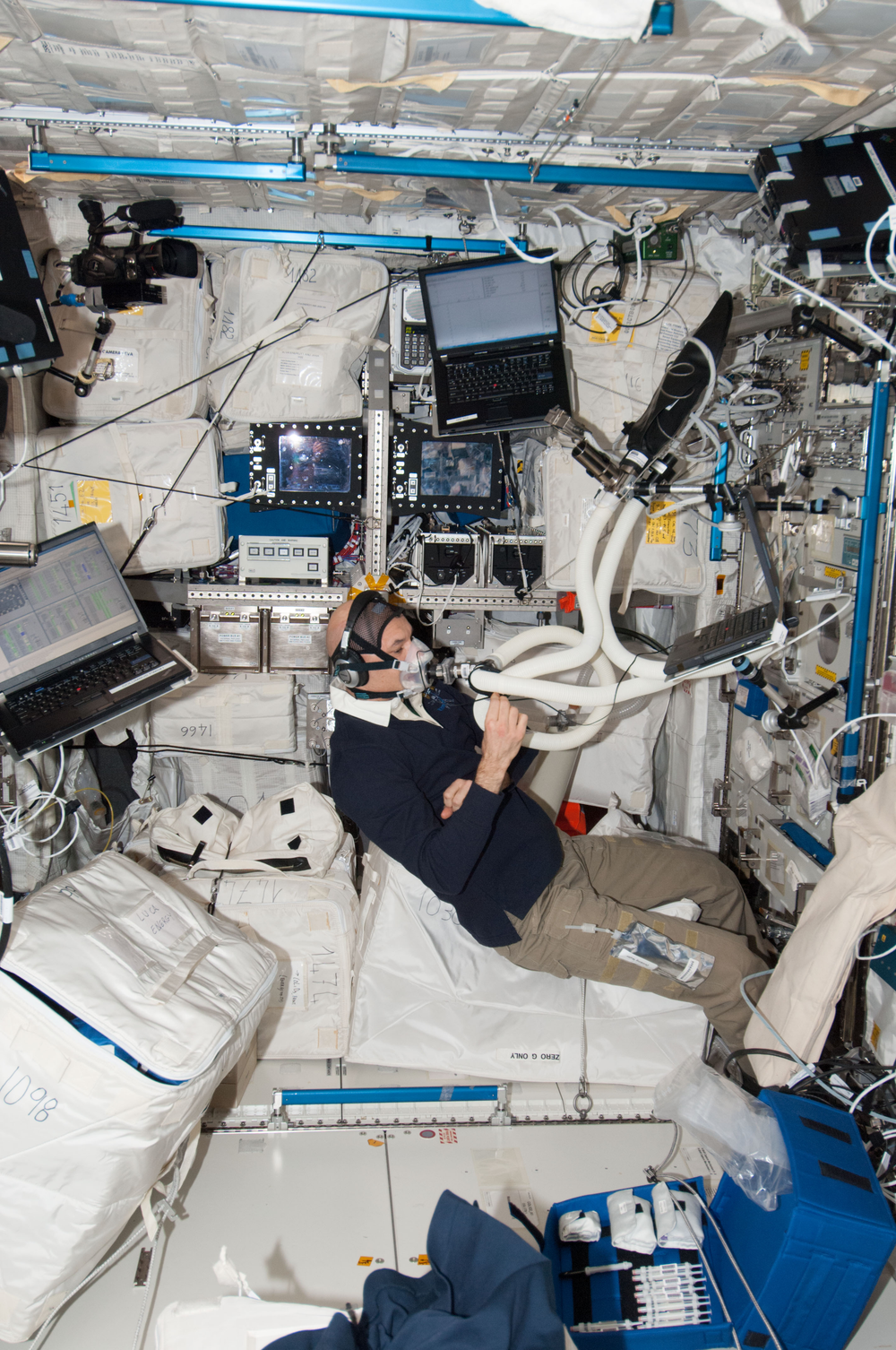 An image of a persona wearing a breathing apparatus aboard the International Space Station.