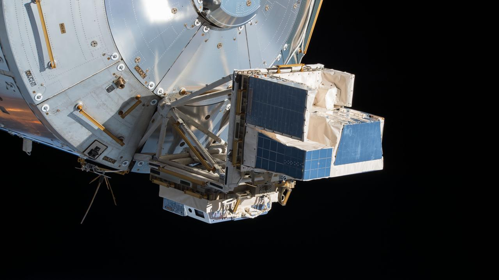 Two International Space Station payloads attached to the exterior of one module.