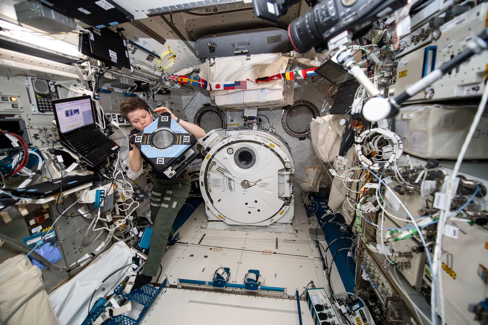 NASA astronaut Anne McClain works inside the Japanese Kibo laboratory module checking out the new Astrobee hardware. 