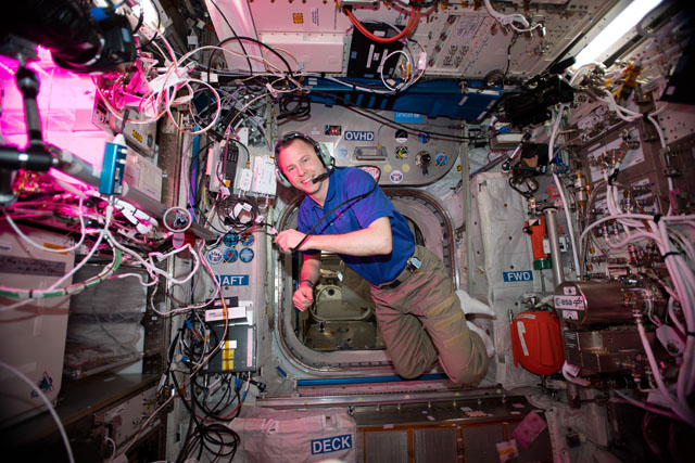 NASA astronaut Nick Hague floats inside the station’s Columbus laboratory module during a HAM radio session using the station’s call sign NA1SS. Credits: NASA