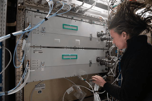 View taken of Spaceborne Computer-2 in Columbus module with astronaut Megan McArthur. Spaceborne Computer-2 further tests techniques for recovering or mitigating errors in the extreme environment of unprotected solar radiation, galactic cosmic radiation (GCR) and other events.