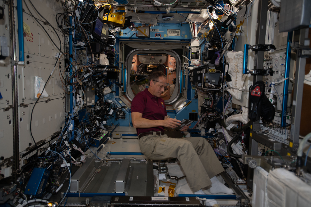 View of Flight Engineer Thomas Marshburn collecting water samples taken during Expedition 66. Credit: Matthias Maurer 