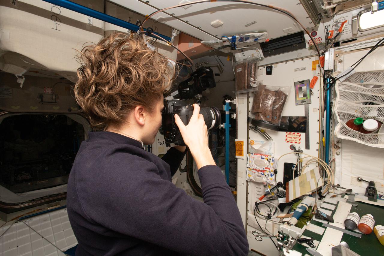 NASA astronaut and Expedition 66 Flight Engineer Kayla Barron snaps pictures of a sample “pit” aboard the International Space Station as part of the SQuARE experiment. Credits: International Space Station Archeological Project/NASA