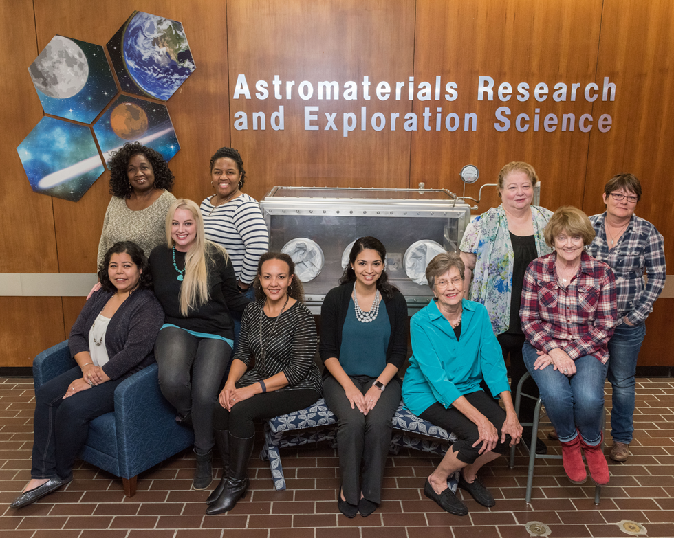 The Astromaterials Research and Exploration Science Division trailblazing women of curation. Seated, from left: Melissa Rodriguez, Rachel Funk, Charis Hall Krysher, Carla Gonzalez, Judy Allton and Carol Schwarz. Standing, from left: Andrea Mosie, Kimberly Allums-Spencer, Linda Watts and Kathleen McBride. Image Credit: NASA/Norah Moran and Josh Valcarcel