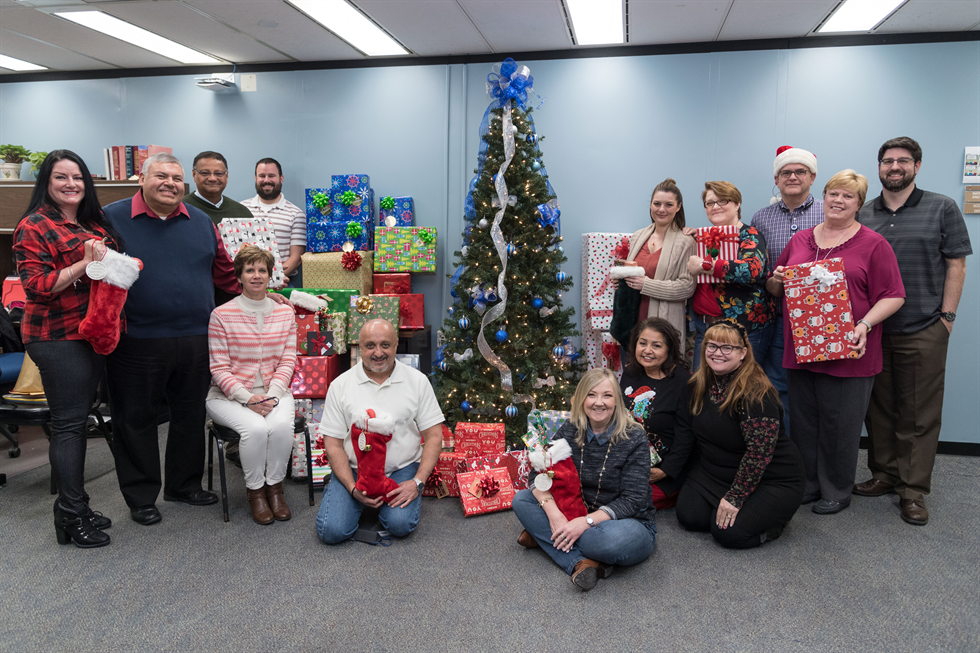 Members of IRD prepare to make the holidays brighter for local children.