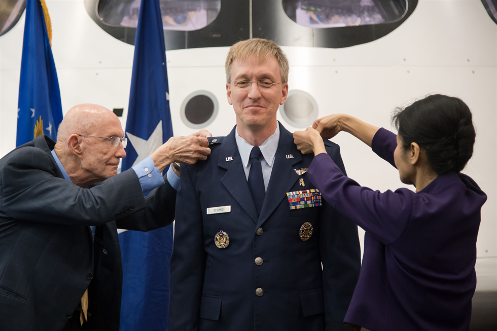 Schmid getting his rank pinned on by Lt. Gen (ret.) Tom Stafford and his wife.