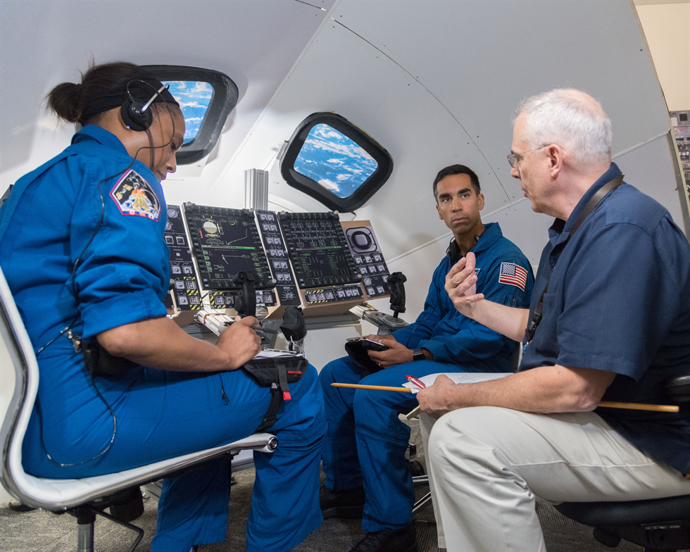 Views taken during a lunar trajectory burn mini-sim in Building 4 South. Astronauts Raja Chari and Jeanette Epps are visible during the simulation. Image Credit: NASA/Norah Moran