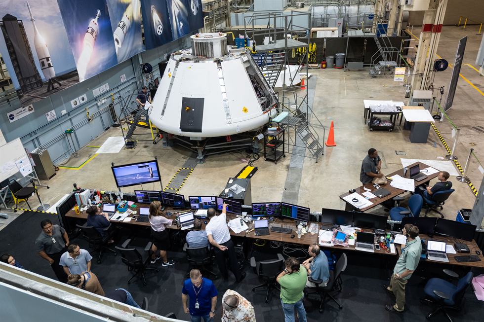 In this group of images, the AA-2 launch abort vehicle test team monitors the Orion crew module's integrated systems as the vehicle is powered on in preparation for a future flight test simulation. Image Credit: NASA/Robert Markowitz