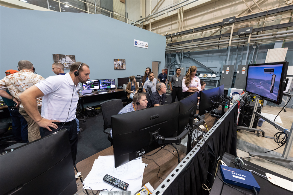 In this group of images, the AA-2 launch abort vehicle test team monitors the Orion crew module's integrated systems as the vehicle is powered on in preparation for a future flight test simulation. Image Credit: NASA/Robert Markowitz