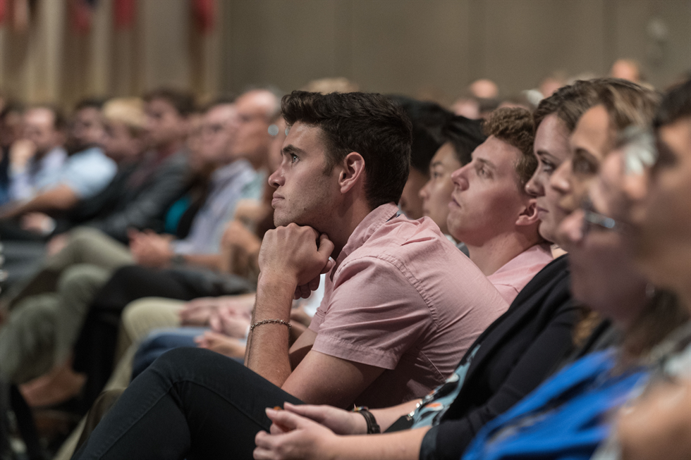 Annual Summer Intern Award Ceremony participants watch the ceremony.