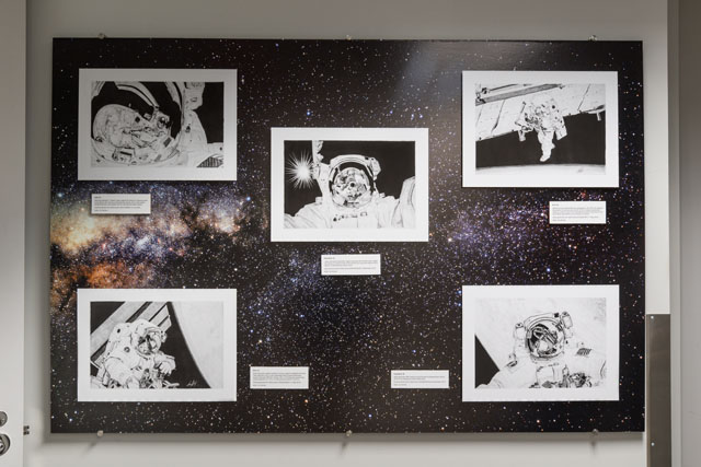 A collage of artist Jim Schultz’s pencil art. Each drawing depicts a photograph taken aboard the International Space Station or space shuttle. The exhibit is located on the third floor of Building 4S, adjacent to the elevator lobby.