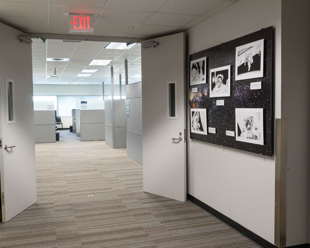 A collage of artist Jim Schultz’s pencil art. Each drawing depicts a photograph taken aboard the International Space Station or space shuttle. The exhibit is located on the third floor of Building 4S, adjacent to the elevator lobby.