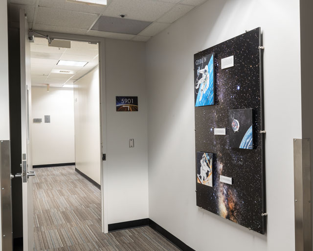 A collage of artist David Hughes’s art. Each painting depicts a historic photograph taken from the Gemini and Skylab programs. The exhibit is located on the fifth floor of Building 4S, adjacent to the elevator lobby. 