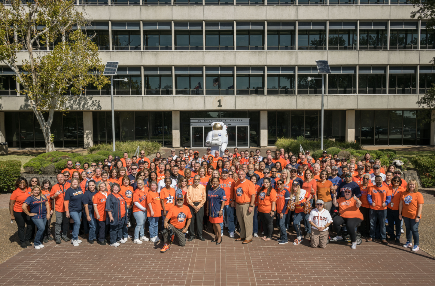 JSC team members gather for Astros photo.