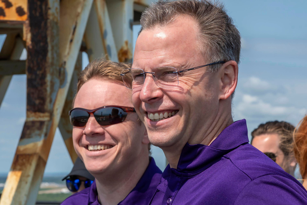 A NASA astronaut and a Roscosmos cosmonaut visit a launchpad at Kennedy Space Center.