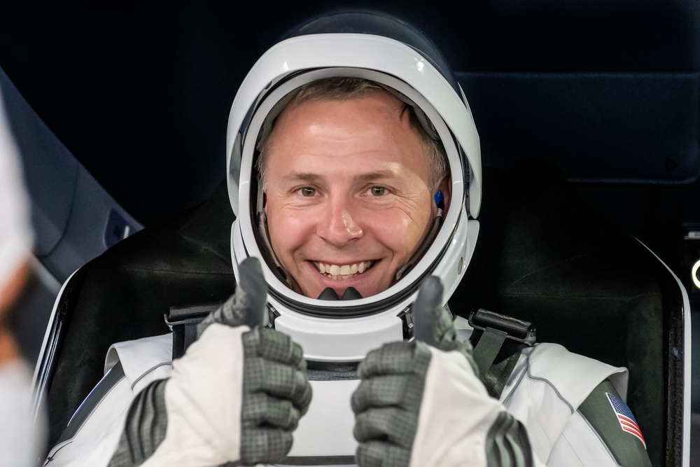 NASA astronaut Nick Hague gives a thumbs up during a spacecraft test.