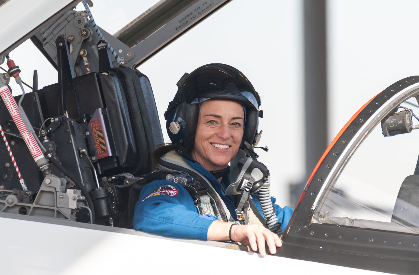 Astronaut Nicole Mann sits inside a T-38 trainer jet at Ellington Field in Houston. Credits: NASA