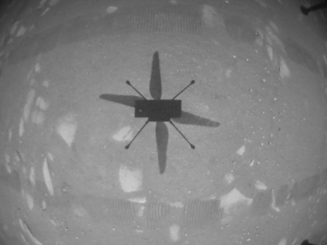 NASA’s Ingenuity Mars Helicopter captured this shot as it hovered over the Martian surface on April 19, 2021, during the first instance of powered, controlled flight on another planet. It used its navigation camera, which autonomously tracks the ground during flight. Credits: NASA/JPL-Caltech