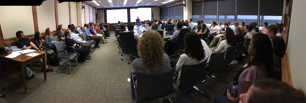 A panorama view of the co-terns enjoying a lively movie night discussion about root causes and lessons learned. Image courtesy of Cody Bryant.