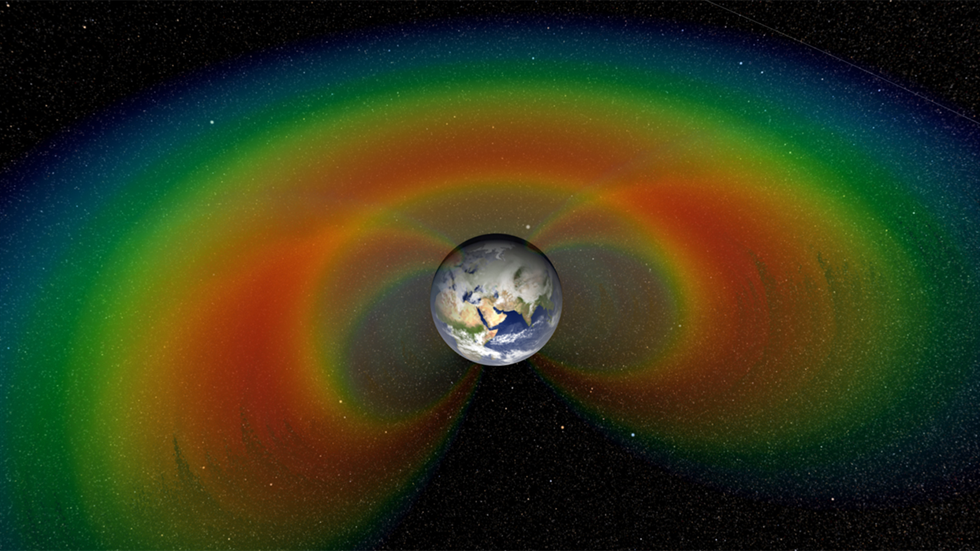 An artist’s depiction, with cutaway section of the two giant donuts of radiation called the Van Allen Belts, that surround Earth. Image Credit: NASA/Goddard Space Flight Center/Scientific Visualization Studio